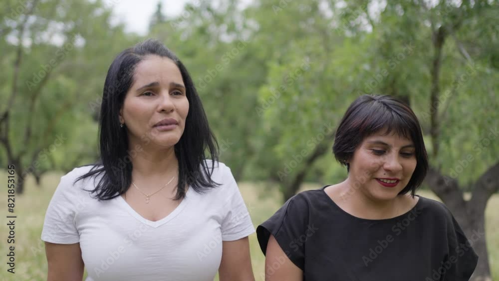 Two latina female friends chatting relaxed while walking.MOV Two latina female friends chatting relaxed while walking.MOV