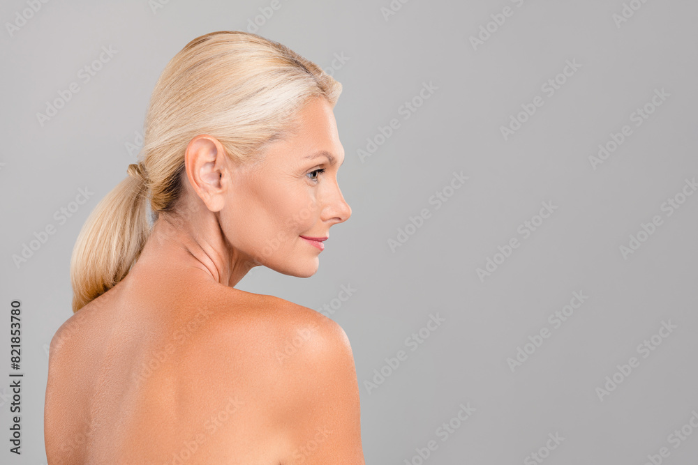 Profile side photo of attractive perfect lady promoting anti age effect cosmetics procedure empty space isolated on gray color background