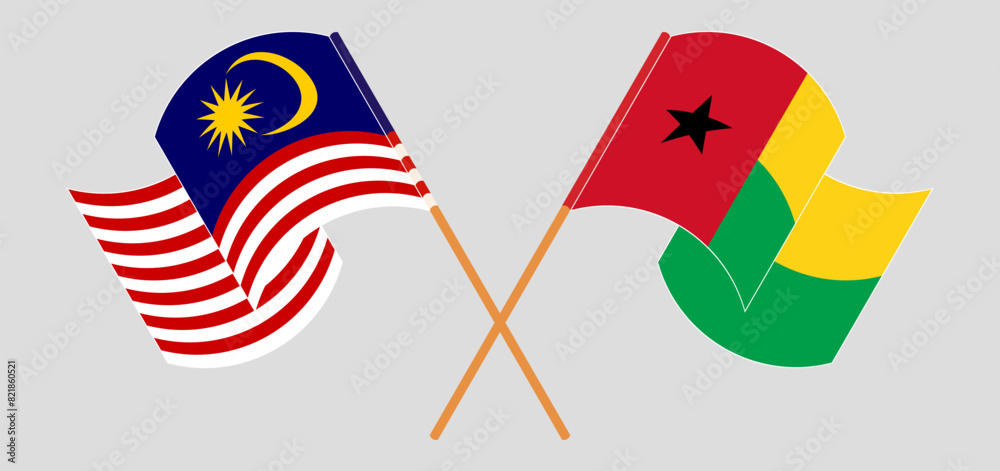 Crossed and waving flags of Malaysia and Guinea-Bissau Crossed and waving flags of Malaysia and Guinea-Bissau