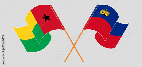 Crossed and waving flags of Guinea-Bissau and Liechtenstein