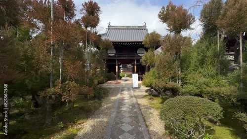 Walkway Towards Entrance Gate To Genko-an Temple In Kyoto, Japan. dolly-in shot photo