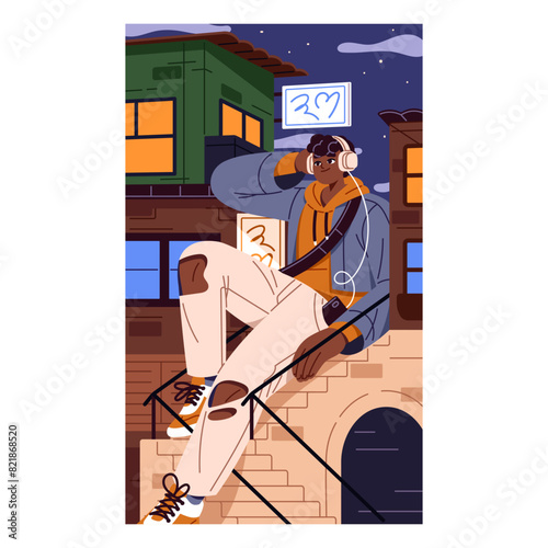 Calm giant teenager sits on stairs and listens to music with headphones at night. Happy enormous person relaxes on city street. Vertical poster about peaceful urban life. Flat vector illustration