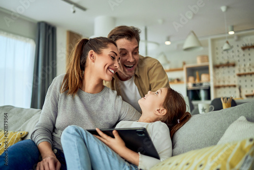 One happy family of three enjoying their time together at home and having fun
