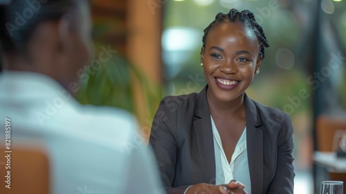 Fototapeta Naklejka Na Ścianę i Meble -  Happy african business woman handshaking at office meeting. Smiling female hr hiring recruit at job interview, bank or insurance agent, lawyer making deal with client at work