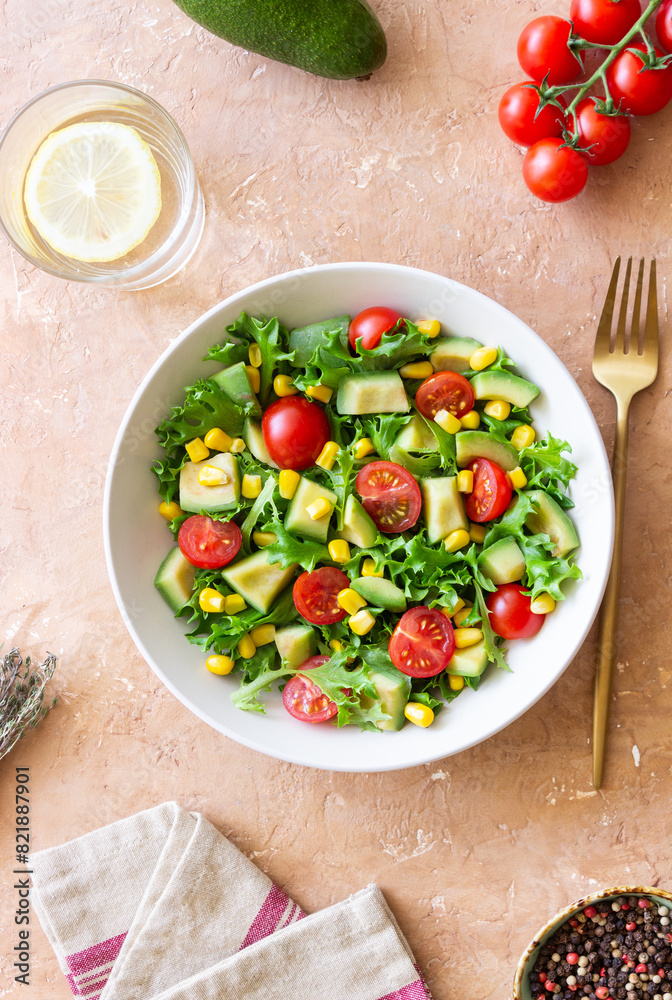 Salad with avocado, tomatoes and corn. Healthy eating. Vegetarian food. Salad with avocado, tomatoes and corn. Healthy eating. Vegetarian food.