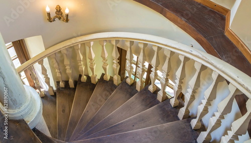 Antique wooden staircase with carved handrails