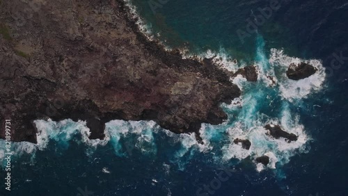 The rugged north-west shore of maui, hawaii, with crashing waves, aerial view photo
