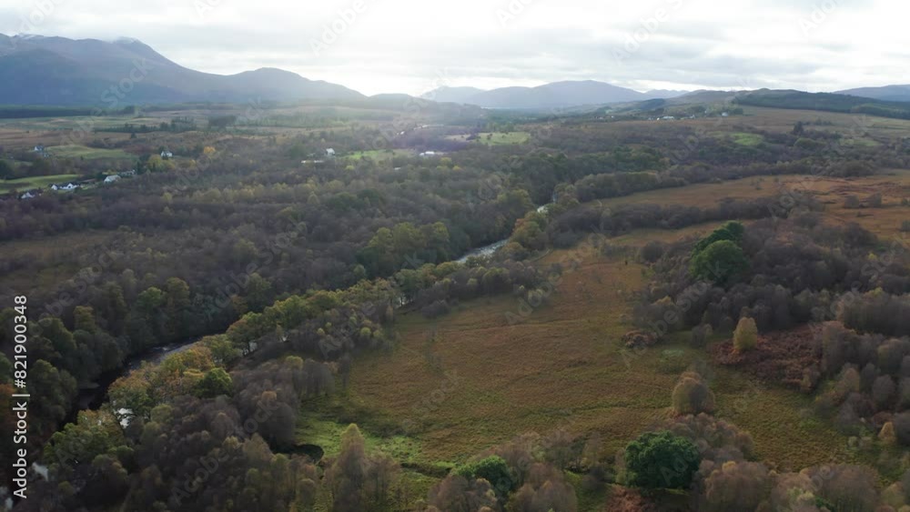 Aerial view of verdant valley with meandering River Spean and majestic mountains, Highlands, Scotland. Aerial view of verdant valley with meandering River Spean and majestic mountains, Highlands, Scotland.