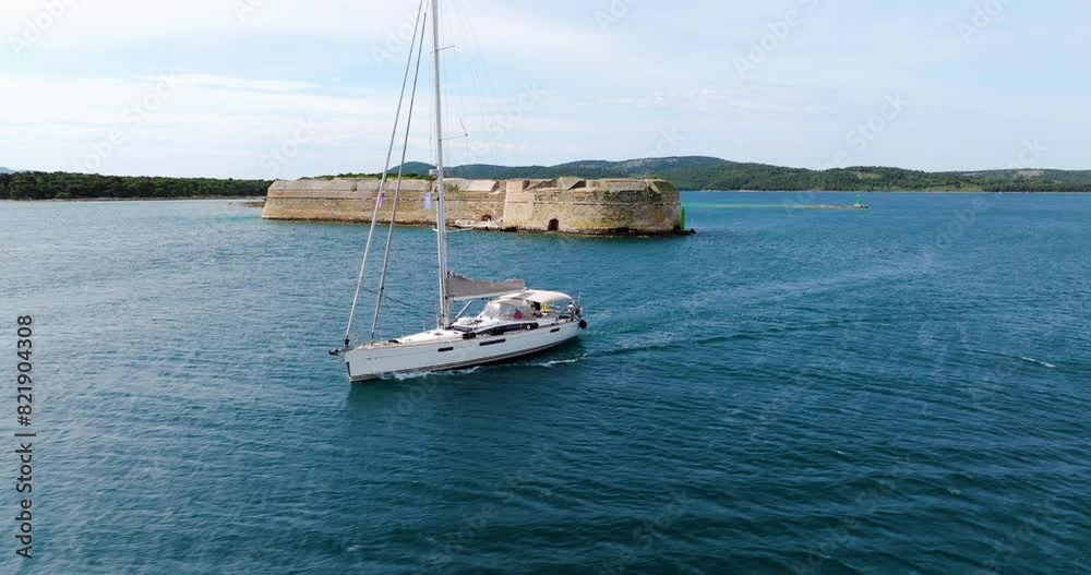 Sailboat Cruising Near St. Nicholas Fortress In Sibenik Town, Croatia, Europe. Aerial Shot