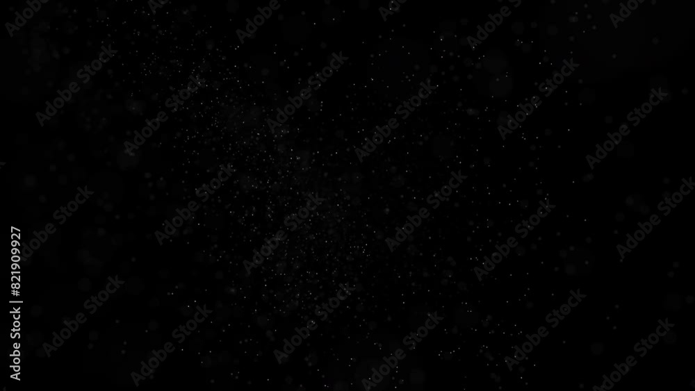 Illuminated dust particles create magical bokeh patterns against black backdrop. Illuminated dust particles create magical bokeh patterns against black backdrop.