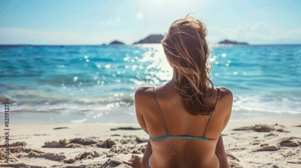 Woman in Bikini Sunbathing on Beach Woman in Bikini Sunbathing on Beach
