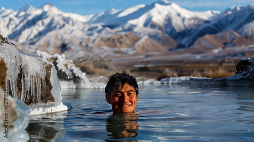 Joyful Young Man Bathing in Mountain Hot Springs During Winter