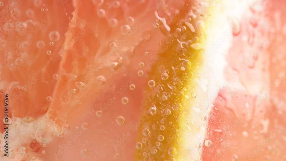 Grapefruit slices and mint in fizzy sparkling tonic with bubbles, juice refreshment carbonated soft drink.