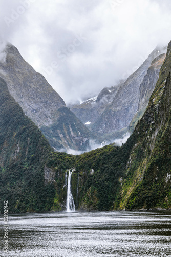 Vertical of Milford Sound Waterfalls in New Zealand on a cloudy day