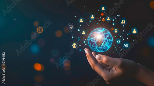Hand of business person with a floating earth globe hologram. Business office center. Concept : Artificial Intelligence, database, big data, information, technology, communication, shipping.