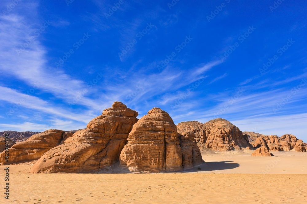 Desert landscape in the Wadi Rum Protected Area with rocky terrain and sand dunes Desert landscape in the Wadi Rum Protected Area with rocky terrain and sand dunes