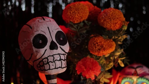Skeleton decoration and cempasuchil blossoms on Dia de Muertos altar. photo