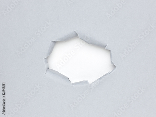 hole in sheet of paper. ripped business paper surface background © Nik_Merkulov