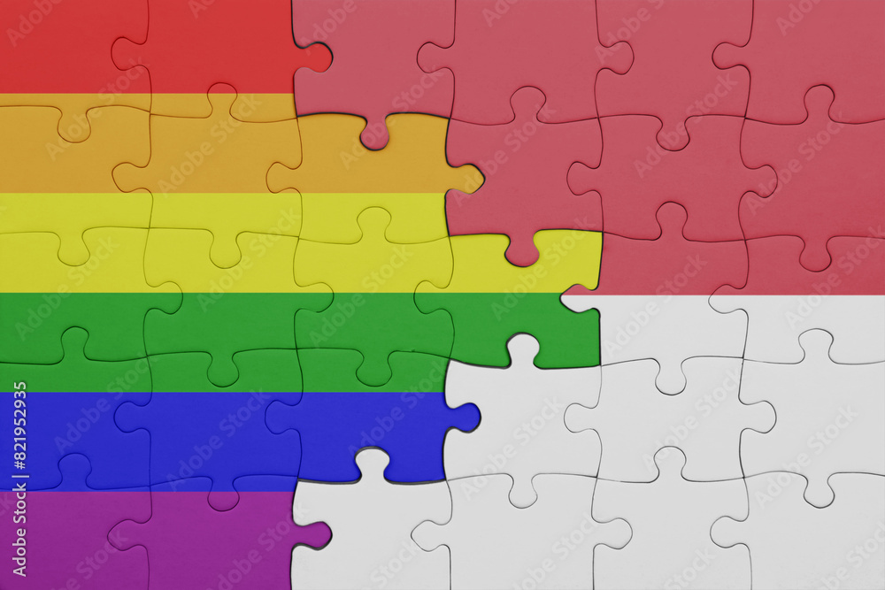 puzzle with the colourful national flag of indonesia and rainbow gay pride flag .