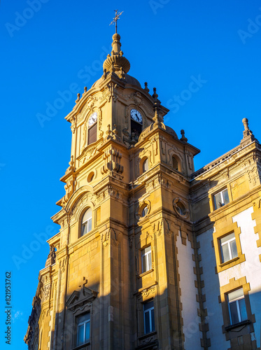 Clock tower of Corazon de Maria Church on a blue sky. San Sebastian, Gipuzkoa, Basque country, Spain.