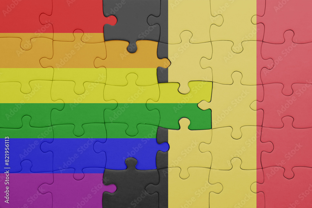 puzzle with the colourful national flag of belgium and rainbow gay pride flag . puzzle with the colourful national flag of belgium and rainbow gay pride flag .