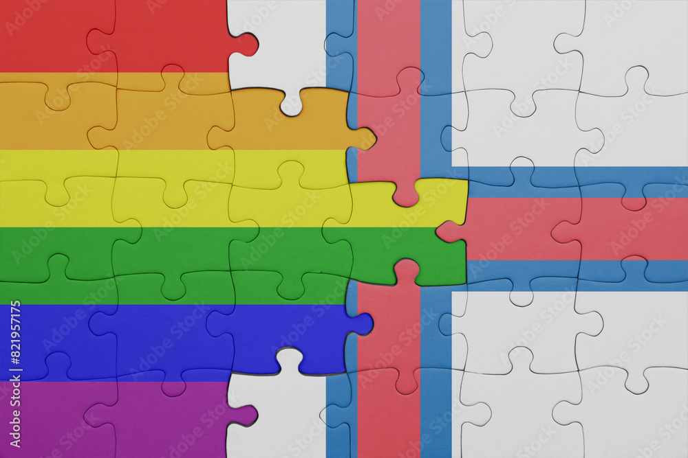puzzle with the colourful national flag of faroe islands and rainbow gay pride flag .