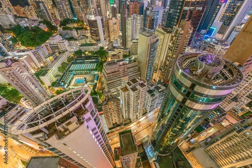 Photography Overhead wide angle view of Hong Kong's financial district showing skyscrapers at night in the Wan Chai area with business centres on Victoria Island illuminated at night