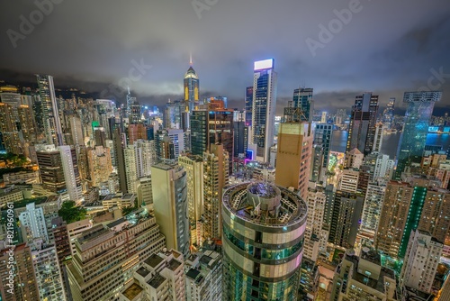 Canvas Print Aerial view of downtown Hong Kong with the skyline of crowded skyscrapers at night in the Wan Chai area