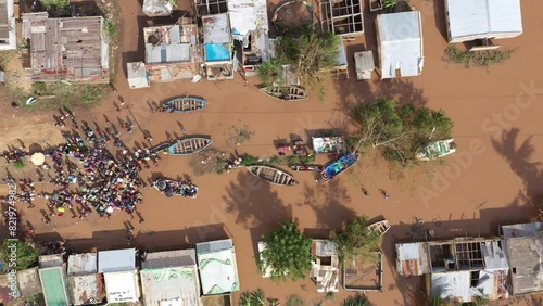 Aerial of the poor population of Africa with boats and old buildings during the flood photo