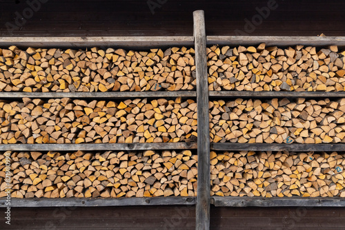 Close-up of wooden house walls with shelves holding firewood in Haanja, Estonia photo