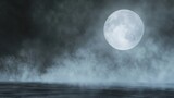A full moon shines brightly in the misty night sky above a serene body of water