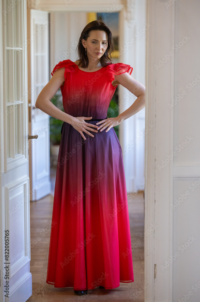 A beautiful black-haired woman among white doors: Pianist and Accompanist A beautiful black-haired woman among white doors: Pianist and Accompanist