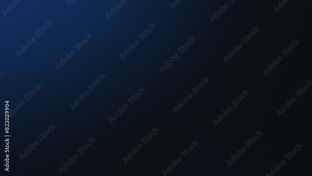 Abstract effect of blurry blue and white bokeh lights on a black background