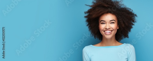 Blue background Happy black independant powerful Woman realistic person portrait of young beautiful Smiling girl Isolated on Background ethnic diversity equality acceptance concept with copyspace blan photo
