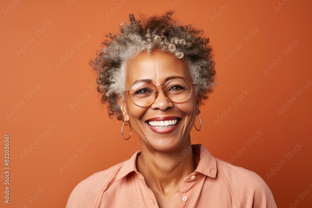 Brown Background Happy black american independant powerful Woman. Portrait of older mid aged person beautiful Smiling girl Isolated on Background ethnic