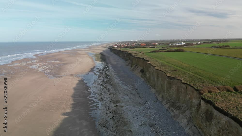 Aerial view of Sangatte Beach with cliffs, ocean, fields, and village, Pas de Calais, France. Aerial view of Sangatte Beach with cliffs, ocean, fields, and village, Pas de Calais, France.