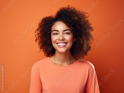 Coral background Happy black independant powerful Woman realistic person portrait of young beautiful Smiling girl Isolated on Background ethnic diversity equality acceptance