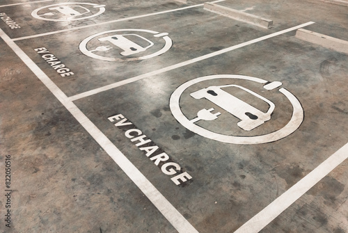 The sign on the floor of a parking lot for EV charge, perspective view