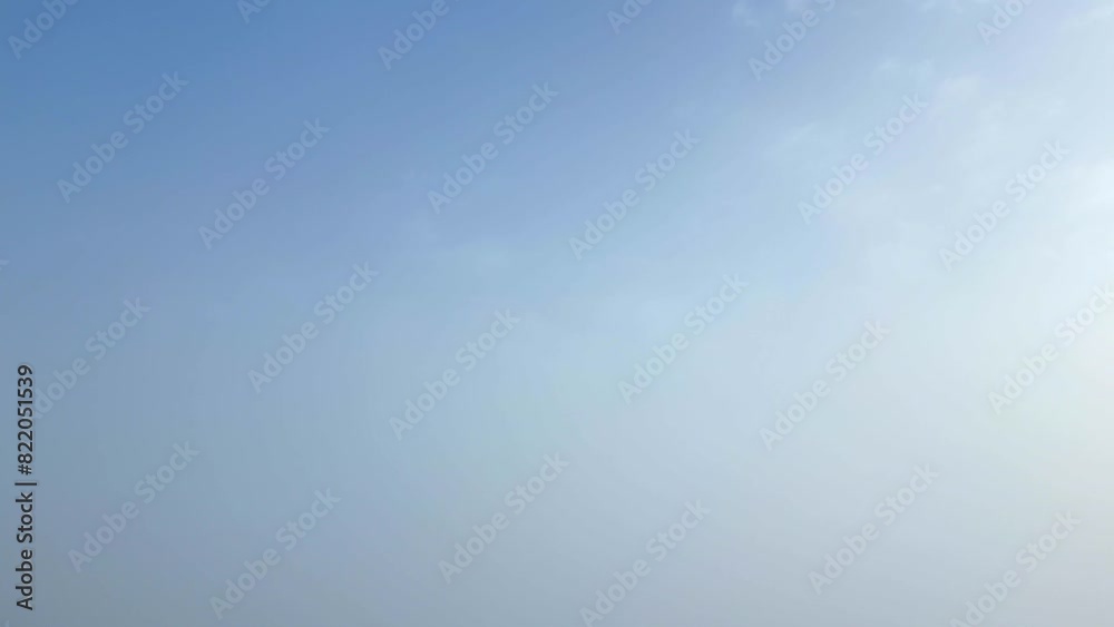 Blue sky gradually turns into white mist as clouds cover the view Blue sky gradually turns into white mist as clouds cover the view