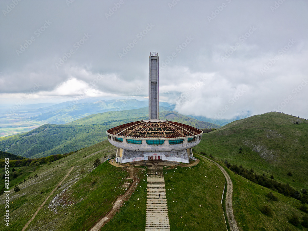 Aerial drone view of The Buzludzha Monument in Kazanlak, Bulgaria. Also known as the Memorial House of the Bulgarian Communist Party, the monument is a striking Brutalist architecture on the mountain