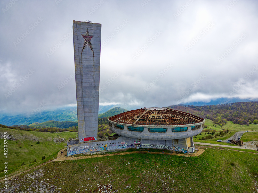 Aerial drone view of The Buzludzha Monument in Kazanlak, Bulgaria. Also known as the Memorial House of the Bulgarian Communist Party, the monument is a striking Brutalist architecture on the mountain