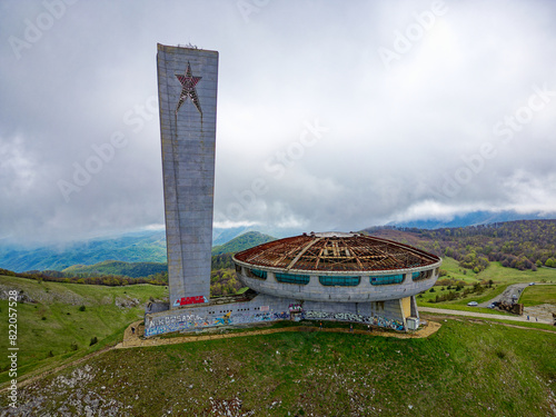 Obraz na płótnie Aerial drone view of The Buzludzha Monument in Kazanlak, Bulgaria. Also known as the Memorial House of the Bulgarian Communist Party, the monument is a striking Brutalist architecture on the mountain w salonie