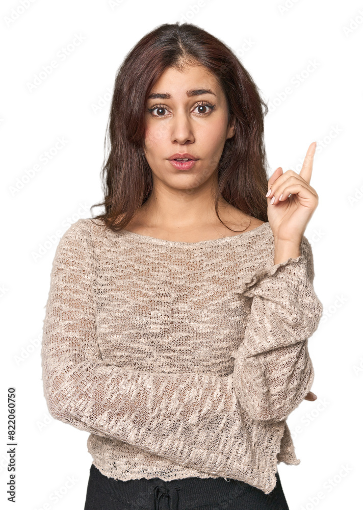 Middle Eastern woman in studio having some great idea, concept of creativity.