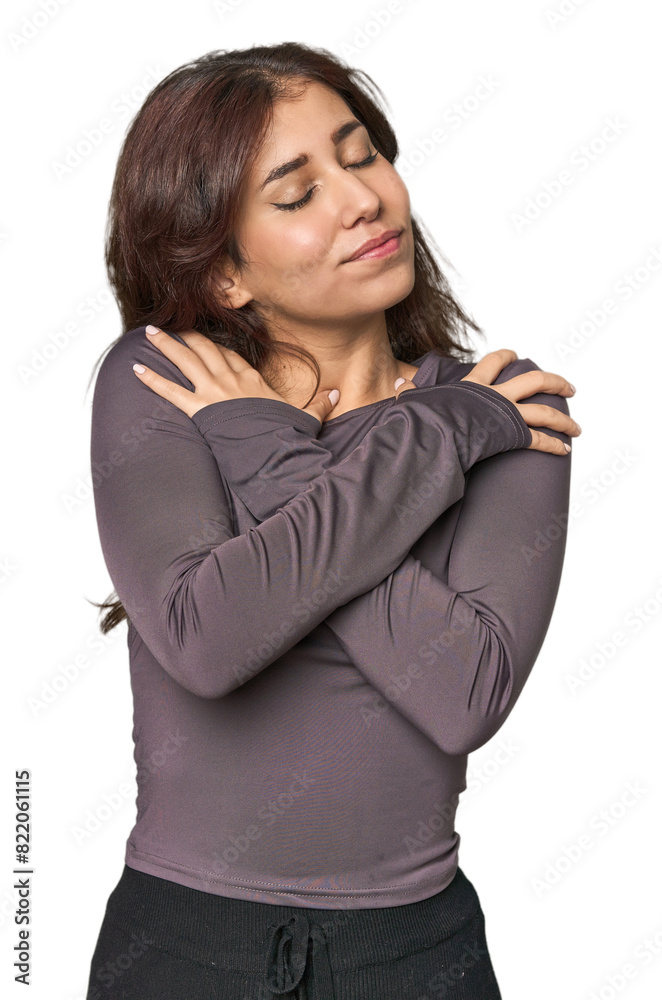 Middle Eastern woman in studio hugs, smiling carefree and happy. Middle Eastern woman in studio hugs, smiling carefree and happy.
