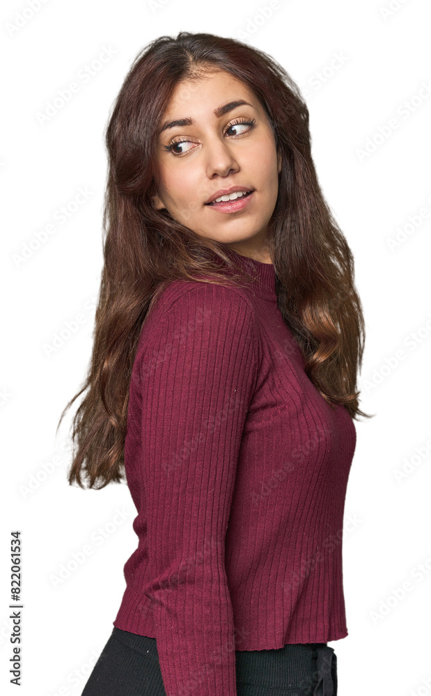 Middle Eastern woman in studio looks aside smiling, cheerful and pleasant. Middle Eastern woman in studio looks aside smiling, cheerful and pleasant.