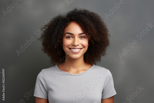Gray background Happy black independant powerful Woman realistic person portrait of young beautiful Smiling girl  © Zickert