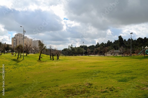 Cloudy sky over Sacher Park with lush greenery, Jerusalem