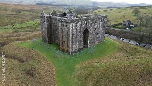 Drone footage of Hermitage Castle in the remote valley of the Hermitage Water, Scotland, UK photo