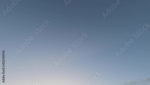 Sunny blue sky scenery with chemtrails and white clouds at the daytime photo