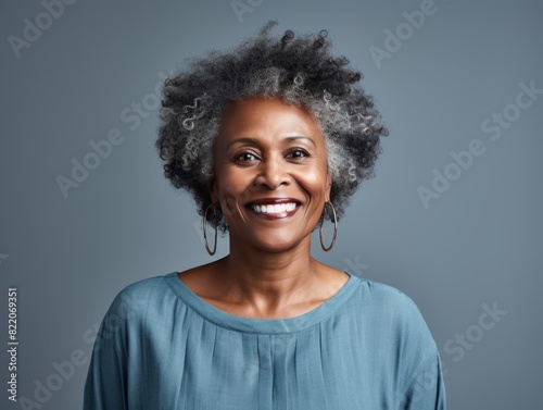 Indigo Background Happy black american independant powerful Woman. Portrait of older mid aged person beautiful